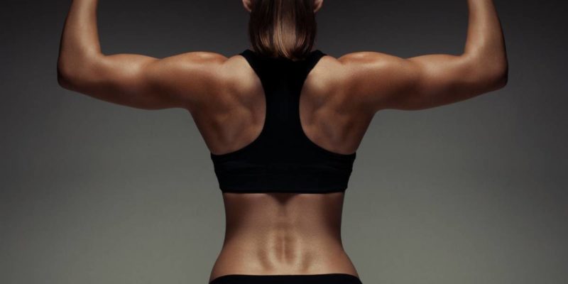 best shoulder workout for strength feature image of woman with defined shoulders