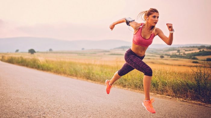 woman sprinting as part of a HIIT workout