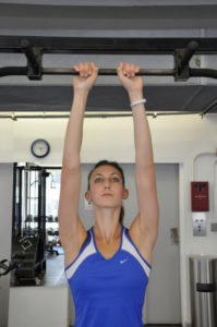 close grip pull up demonstrated by female
