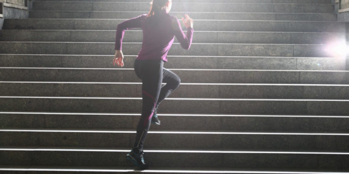 Women running up stairs