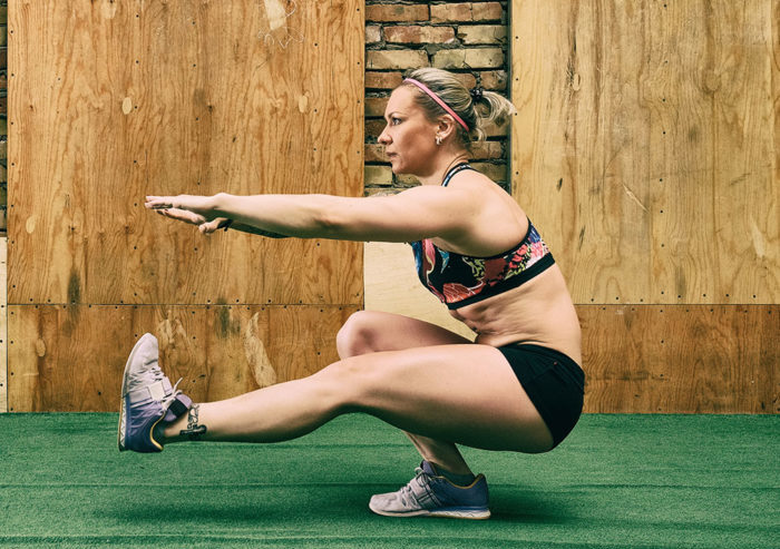 woman performing a single leg squat