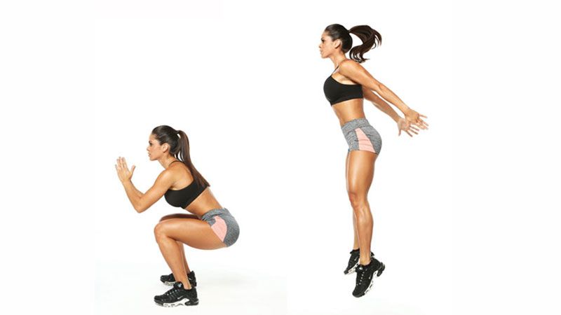 Female athlete performing jump squats to build her booty