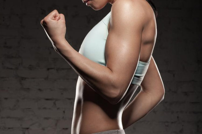 woman with strong arms and muscle hypertrophy
