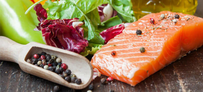 Example of a pescatarian diet featuring salmon and black peppercorns
