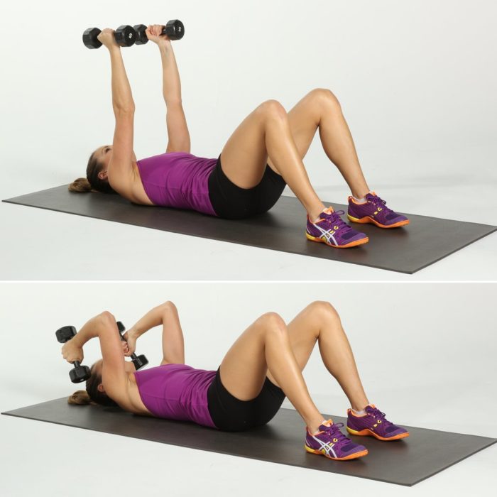 woman performing a skull crusher as part of her triceps workout for women