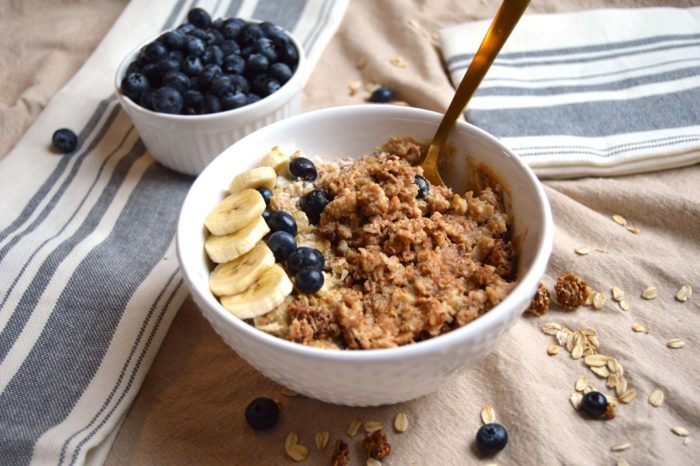 Bowl of oatmeal with banana and blueberry on top