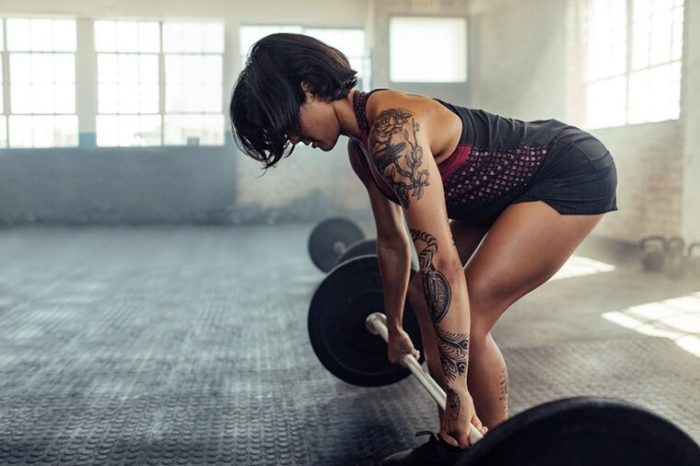 woman about to do a deadlift